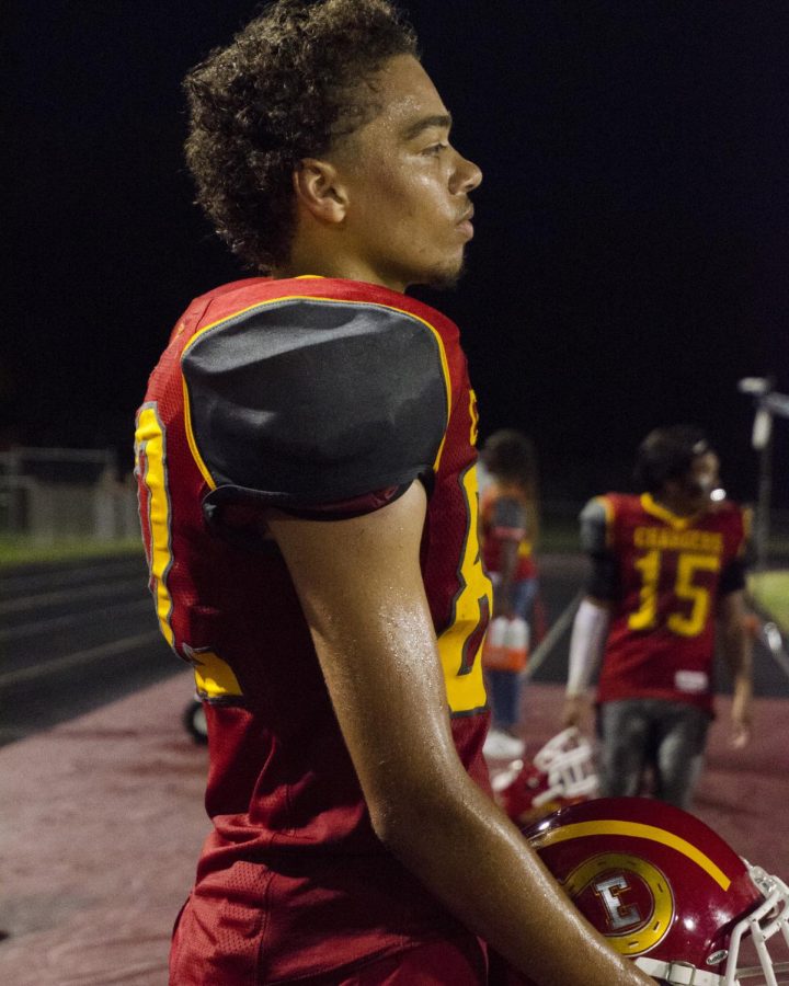Senior Ben Roby looks on from the sidelines of charger field as the Crimson Chargers play Elkhart Central on Friday, Aug. 17, 2018.

