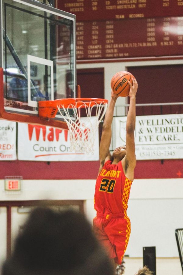 Senior Javon Forester rises up for a dunk in Fridays basketball game against Goshen. The Chargers went home with a 53-48 victory over the Redhawks.