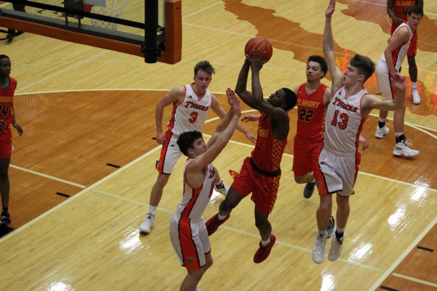 Senior Jai-Veon Qaiyim rises up for a tough layup in the first half of the Chargers game. Elkhart Memorial won 48-45.