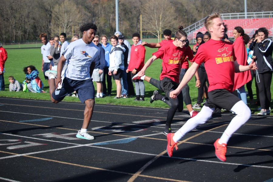 From left to right, (Central) Junior Marktavion Browning, Senior Brian Ketcham, and Senior John Rehmels are crossing the finish line during the 400m run on April 26th, 2019. 