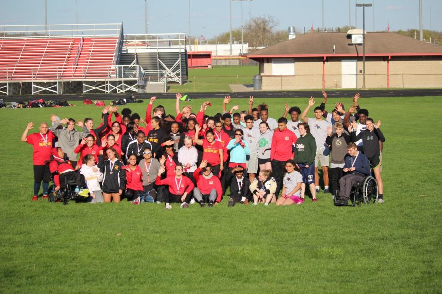 The Unified Track Team is waving as the meet is concluding on Friday April 26th 2019. They just competed against  rival team Elkhart Central and won 142-112.