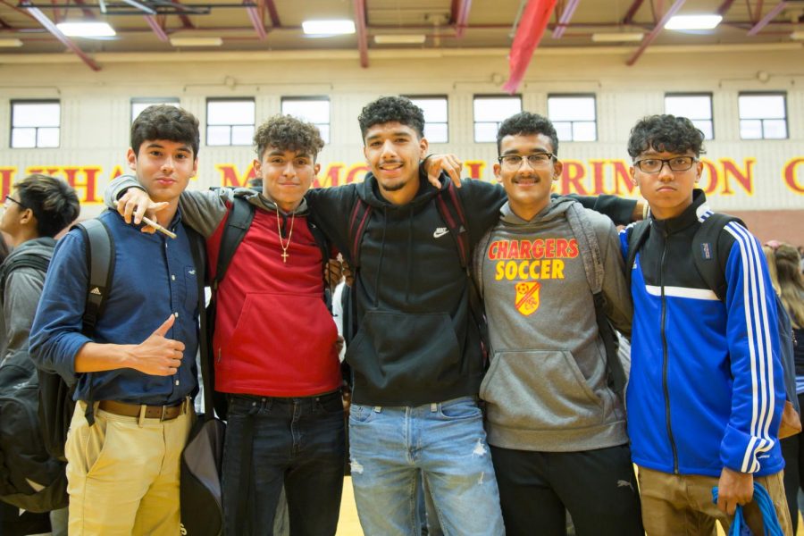 Seniors Juan Diaz, Christian Banuelos, Damian Vargas, Adgell Herasme, and Josh Flores enjoy hanging out together at the homecoming pep-rally on Oct. 4. All varsity sports were recognized.