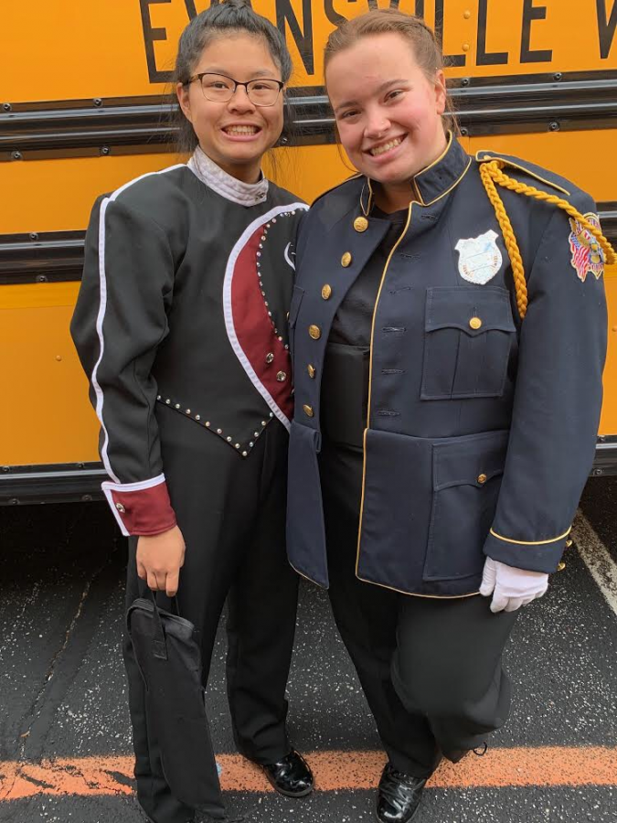 Drum Major junior Maddie Fendrick and percussionist junior Lauren Stubbs pose for a picture together at Pike High School before the Semistate band competition on Saturday, Nov. 2. While the Crimson Charger Command placed 12th, missing State qualification by two places, members felt that their performance was solid. 
