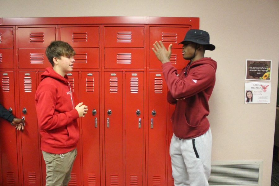 ASL 1 students Freshmen Trevor Fine and Rodney Gates practice introducing themselves and communicating their daily schedules on Monday, Nov. 25.