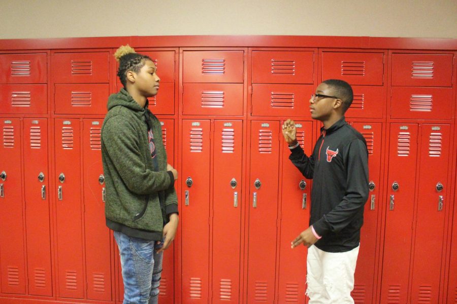 Freshman Izavier Jennings and Sophomore JoEdward Bynum practice signing about their daily schedule for their video assignment on Monday, Nov. 25.