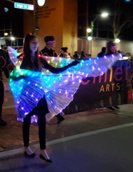 A performance group from Premier Arts walks through downtown Elkhart during the Winter Parade on Saturday, Dec. 7.