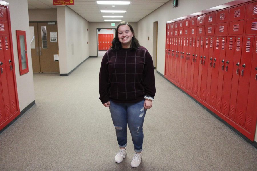 Junior Madalynn Fendrick  takes time during class to pose for a picture on Thursday, Jan. 23 for throwback day.