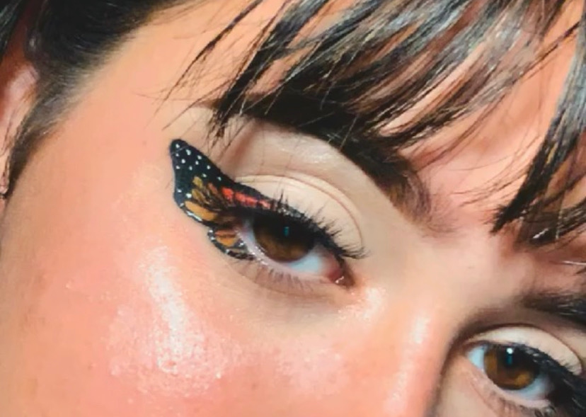 Senior Molly Wruble shows off her butterfly wing makeup. Besides doing makeup, she also has a passion for painting and drawing. 