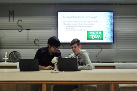 Seniors Sean Khomphengchan and Noah Hardy work as student-interns at the Memorial Tech Service Desk on Wednesday, Dec. 5. 