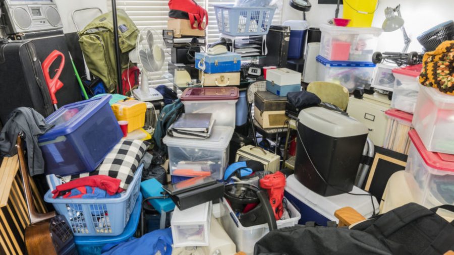 Hoarder+room+packed+with+stored+boxes%2C+electronics%2C+files%2C+business+equipment+and+household+items.