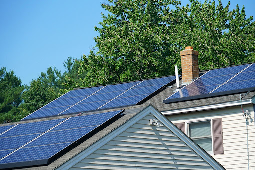 Solar panels are installed on a house roof.