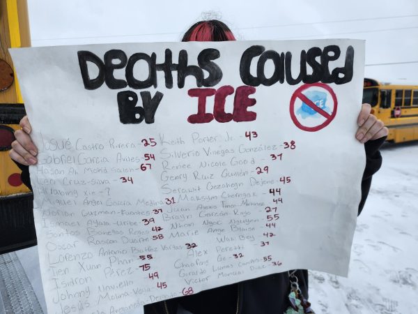 A student protest sign is displayed.