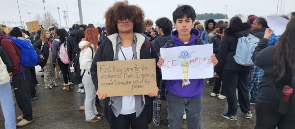 Two students pose with their protest signs.