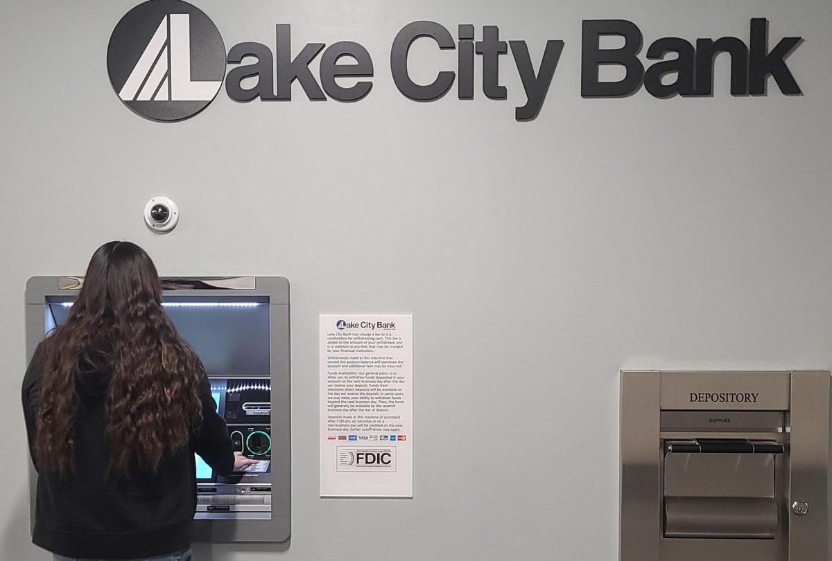 Student attempts to use the ATM.