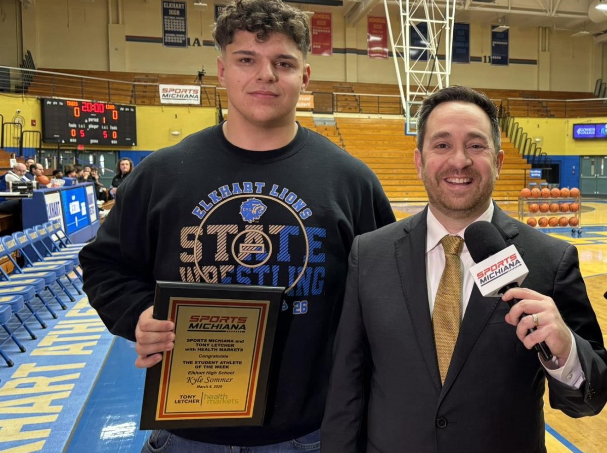 Kyle Sommer is presented with an award.