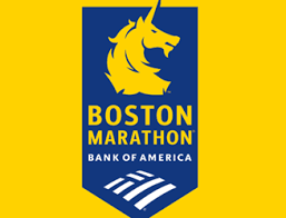 Boston Marathon blue-and-gold logo has a unicorn named Spike at the top.