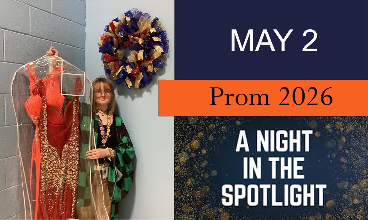 Prom goer holding up dress.