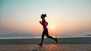 A woman jogs in warm weather.
